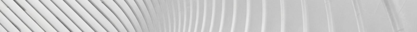 Abstract white curved architectural structure with repeating ribbed patterns creating rhythmic shadows
