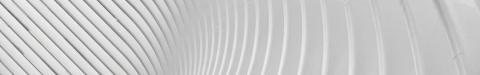 Abstract white curved architectural surface with parallel ridges creating wave-like pattern